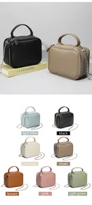 Détails du mini sac à main en cuir véritable avec fermetures éclair et bandoulière