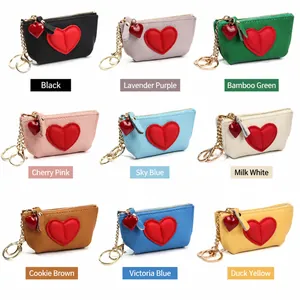 Mini genuine leather coin purses with heart pattern in nine vibrant colors and keychains