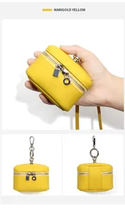 Detailed views of a Marigold Yellow leather coin pouch with zipper and lanyard