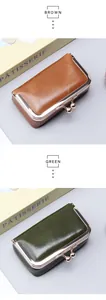 Close-up of vintage leather coin purses in brown and green with golden metal clasps