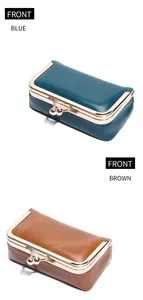 Front view of vintage oil wax leather kiss lock jewelry pouches in blue and brown colors