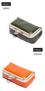 Front view of green and orange kiss-lock pouches in vintage glossy oil-wax leather finish