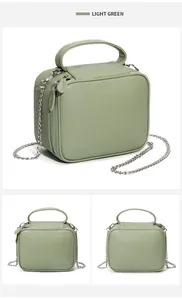Détails du sac à main vert clair en cuir grainé avec chaîne argentée et fermeture éclair