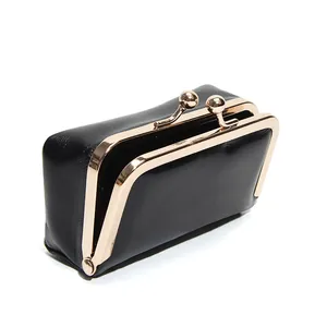 Retro black leather kiss-lock mini bag with gold metal frame for jewelry and coins