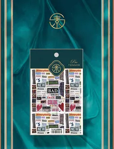 Detail of TS-660 pop newspaper nail art sticker with vintage typography and retro motifs
