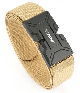 Detail of khaki tactical belt with matte black magnetic buckle and woven nylon texture