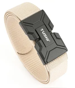 Close-up of khaki tactical nylon belt with black magnetic buckle and TUSHI logo