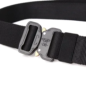Detail of a tactical nylon belt featuring a quick-release metal buckle and heavy-duty weave