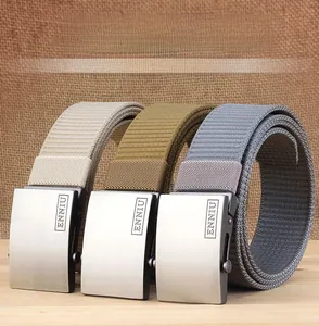 Close-up of brushed metal automatic buckles on thick nylon woven belts in three colors
