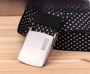 Close-up of tactical nylon belt featuring snowflake pattern and brushed metal buckle