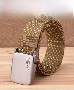 Macro detail of brown woven nylon tactical belt with matte silver buckle and brand logo