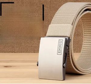 Detailed macro of khaki tactical nylon belt with matte metal buckle and textured weave
