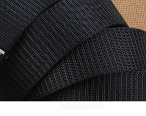 Macro detail of high-gloss black nylon belt featuring a durable tank-pattern weave