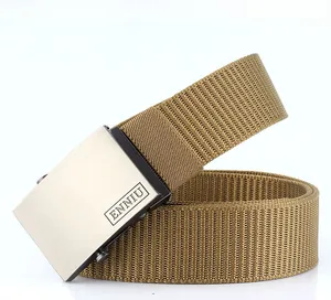 Detail of khaki nylon belt with a brushed metal automatic buckle and logo engraving