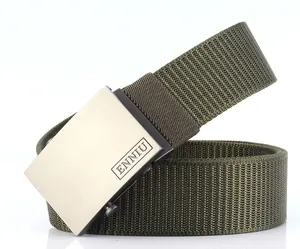 Detail of army green nylon belt with brushed metal square buckle and engraved logo