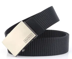 Close-up of black nylon web belt with brushed alloy buckle featuring engraved logo