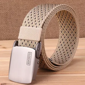 Detailed close-up of textured woven nylon belt with brushed metal buckle and engraved logo