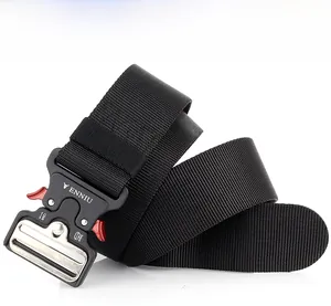 Macro shot of 24kN metal quick-release buckle with red levers on black tactical nylon belt
