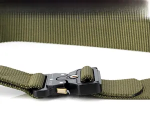 Close-up of olive green tactical nylon belt with black metal quick-release buckle