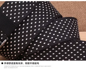 Close-up of durable black nylon tactical belt webbing with white snowflake pattern texture
