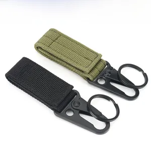 Detail of heavy-duty nylon tactical keychain clips in black and olive green with metal hooks