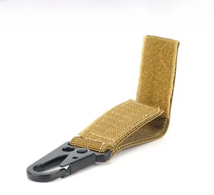 Detail of Coyote Brown tactical nylon webbing with heavy-duty metal eagle beak hook