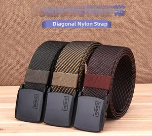 Close-up of three twill nylon belts with YKK plastic buckles in multi-color stripes