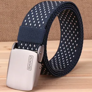 Detail of blue canvas tactical belt with snowflake pattern and matte metal buckle