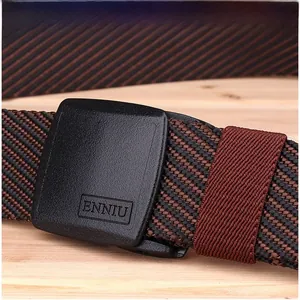 Macro shot of two-tone nylon woven belt with a matte black buckle and elastic loop