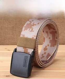 Macro detail of desert camo nylon tactical belt featuring smooth black plastic buckle
