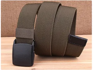 Close-up of olive green braided nylon belt with black plastic buckle on wood