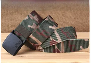 Close-up of camouflage nylon tactical belt with anti-allergy plastic buckle on wood