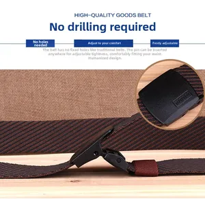 Detail of a brown striped woven belt with an adjustable black YKK plastic buckle