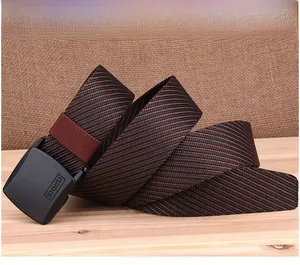 Close-up of black and brown nylon belt with anti-allergy YKK buckle on wood