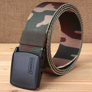 Camouflage nylon tactical belt with black plastic buckle on rustic wooden background