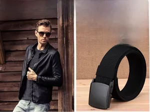 Detail of men's black nylon belt with matte YKK buckle and casual woven texture style