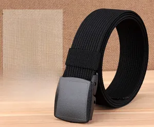 Macro detail of black nylon outdoor belt with matte plastic YKK buckle and rib texture