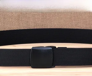 Close-up of black elastic nylon belt with durable YKK buckle on rustic wood surface