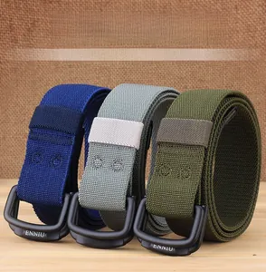 Detail of three stretch nylon tactical belts with matte black double-ring metal buckles