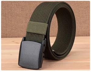 Close-up of army green nylon tactical belt with YKK buckle on wood background