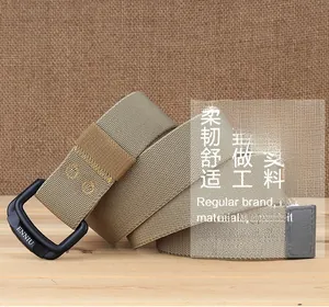 Detail of matte black double ring buckle with ENNIU logo on khaki nylon belt