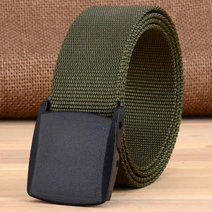 Detail of army green nylon belt with matte black YKK buckle on wood surface