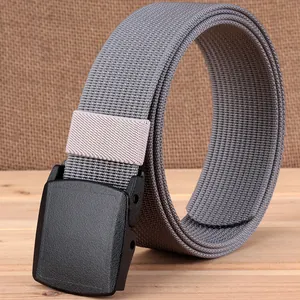 Tactical nylon belt with YKK plastic buckle on rustic wooden and burlap background
