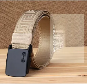 Detail of khaki nylon web belt with Greek fret pattern and matte black buckle
