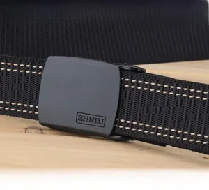 Macro detail of YKK POM plastic buckle on heavy duty nylon belt with a textured weave