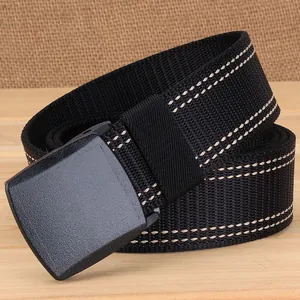 Detail of black nylon belt with YKK plastic buckle and contrast double stitching