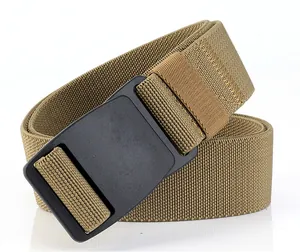Detail view of khaki tactical stretch belt with durable black Duraflex plastic buckle