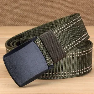 Detail of army green nylon web belt with YKK plastic buckle and white dotted texture