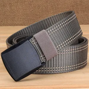 Close-up of thick nylon belt with YKK plastic buckle on a rustic background