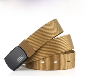 Detail of coyote brown nylon tactical belt with matte black buckle and logo